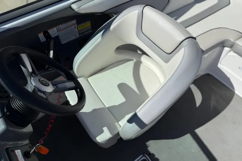 Slide: The Image of 2017 Yamaha AR190 boat interior with steering wheel and captain's seat. - 29