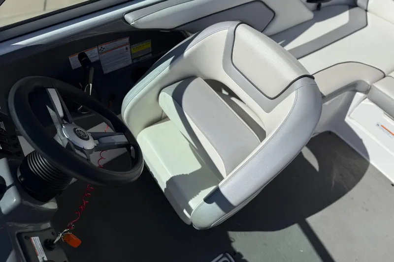 Slide: The Image of 2017 Yamaha Boats AR190 interior with steering wheel and captain's seat. - 30