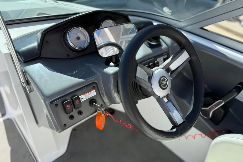 Slide: The Image of 2017 Yamaha AR190 boat dashboard with steering wheel and control panel. - 31