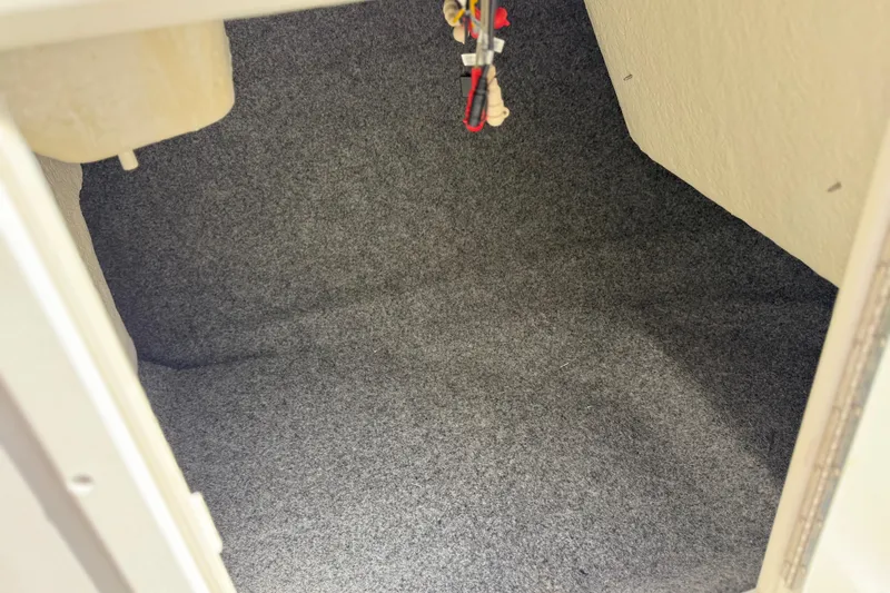 Slide: The Image of Carpeted storage compartment in a 2017 Yamaha Boats AR190. - 40