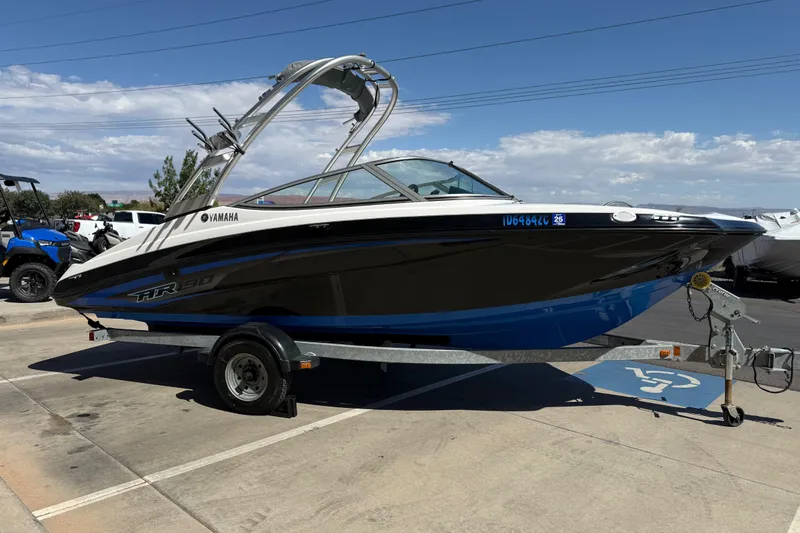 Slide: The Image of 2017 Yamaha AR190 boat on trailer under clear sky. - 8