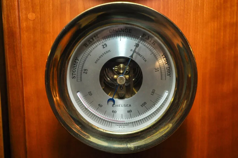 Slide: The Image of Barometer on 1986 Hinckley Sou'wester 51 yacht, displaying weather conditions. - 102