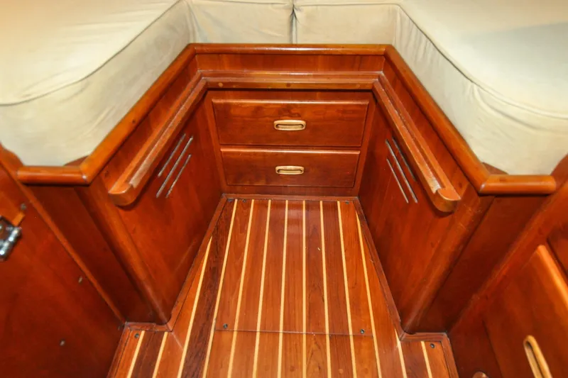 Slide: The Image of Hinckley Sou'wester 51 (1986) interior with wooden cabinetry and striped flooring. - 140