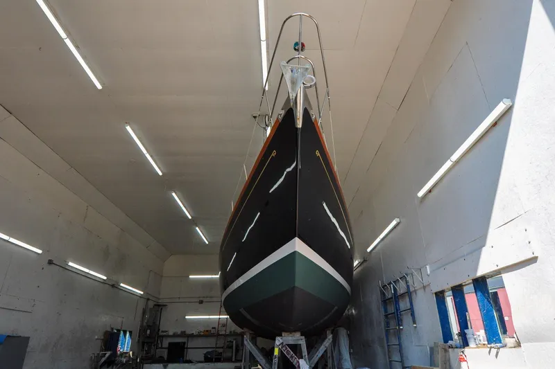 Slide: The Image of 1986 Hinckley Sou'wester 51 sailboat in a well-lit indoor facility. - 3