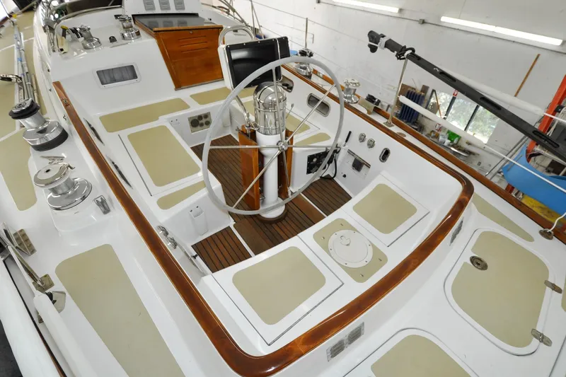 Slide: The Image of 1986 Hinckley Sou'wester 51 sailboat cockpit with wooden accents and steering wheel. - 37