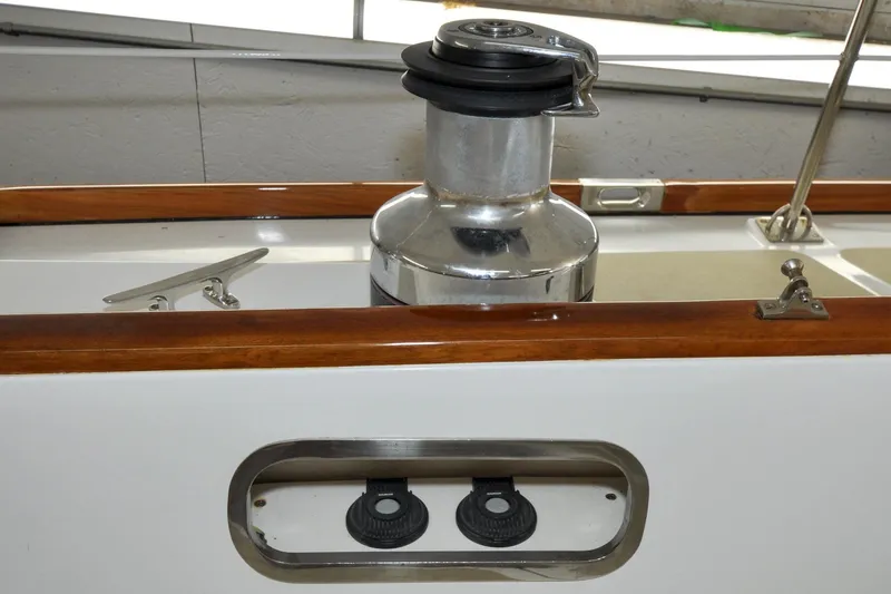 Slide: The Image of Hinckley Sou'wester 51 sailboat deck detail, featuring winch and cleat, 1986 model. - 38
