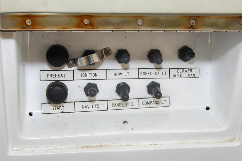 Slide: The Image of Control panel of a 1986 Hinckley Sou'wester 51 sailboat with labeled switches. - 41