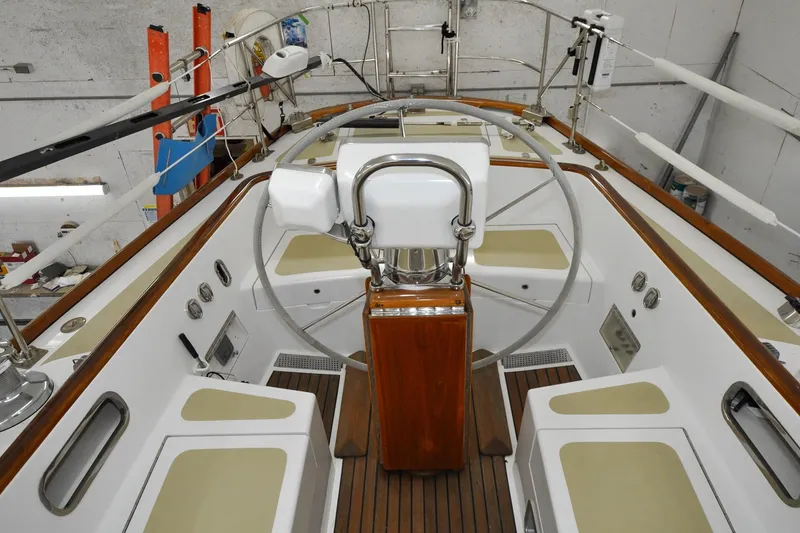 Slide: The Image of Cockpit of 1986 Hinckley Sou'wester 51 sailboat with wooden and white accents. - 51