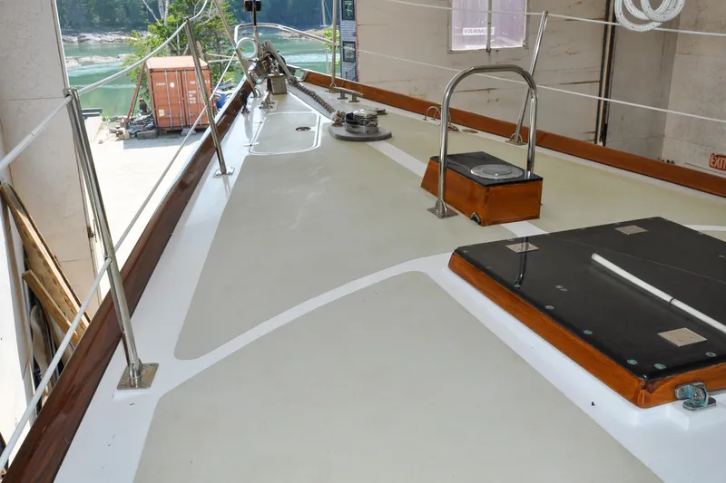 Slide: The Image of Deck of 1986 Hinckley Sou'wester 51 sailboat in a marina setting. - 67