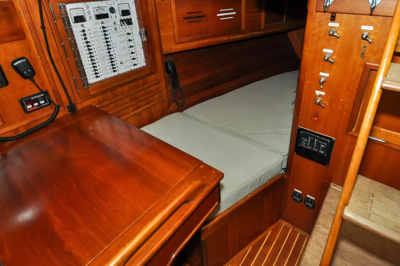 Slide: The Image of Interior of 1986 Hinckley Sou'wester 51 sailboat with wooden cabinetry and control panel. - 74