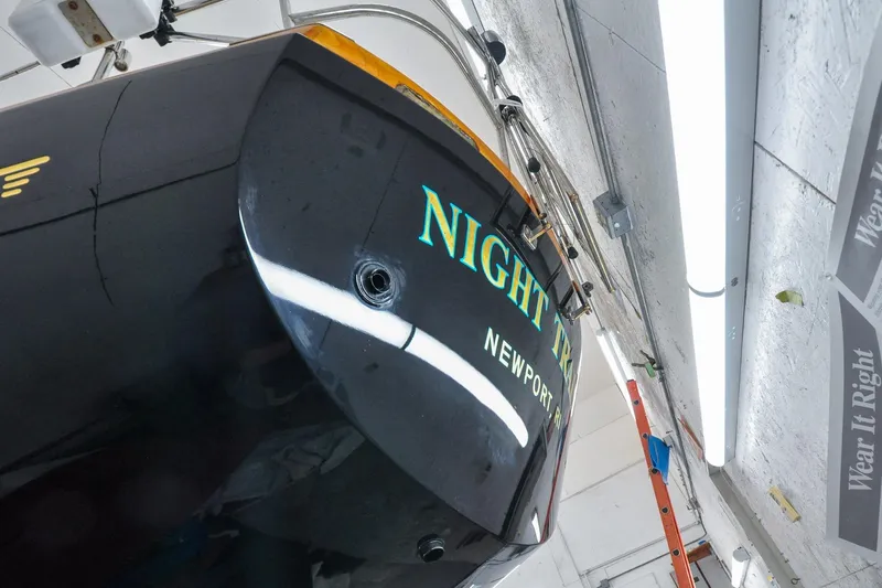 Slide: The Image of Hinckley Sou'wester 51 sailboat, 1986 model, in a workshop with "Night Train" name visible. - 10