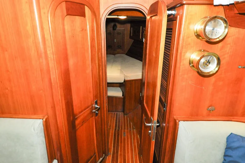 Slide: The Image of Interior of 1986 Hinckley Sou'wester 51 sailboat with wooden finish and cozy cabin. - 105