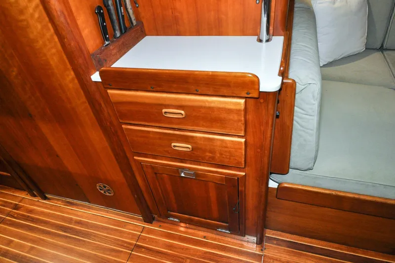Slide: The Image of Interior of 1986 Hinckley Sou'wester 51 yacht with wooden cabinetry and seating. - 125