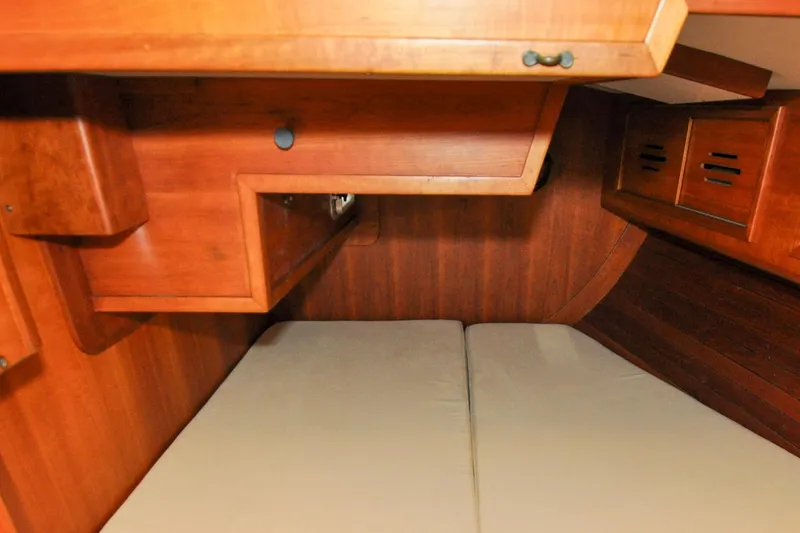 Slide: The Image of Interior cabin of 1986 Hinckley Sou'wester 51 sailboat with wooden finish. - 139