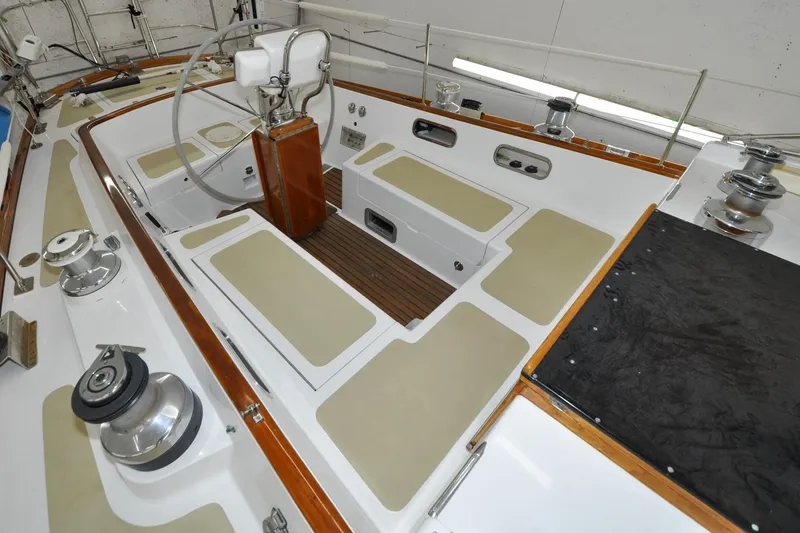 Slide: The Image of 1986 Hinckley Sou'wester 51 sailboat cockpit with wooden accents and steering wheel. - 15