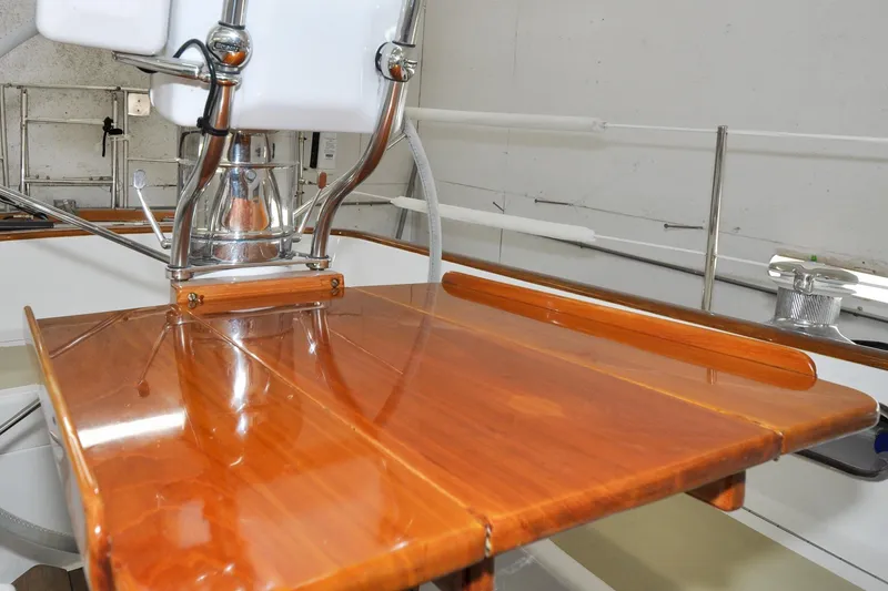 Slide: The Image of Polished wooden helm station on 1986 Hinckley Sou'wester 51 sailboat. - 18