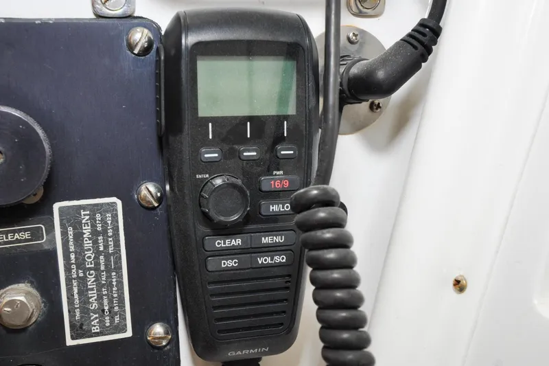 Slide: The Image of Garmin marine radio on 1986 Hinckley Sou'wester 51 sailboat, featuring communication controls. - 28