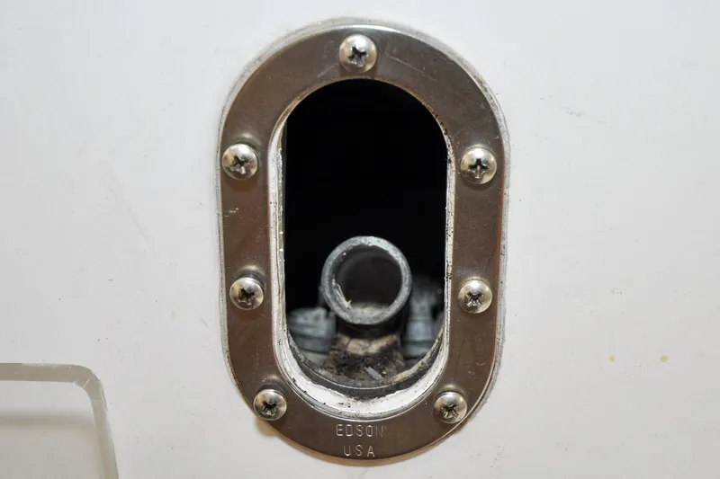 Slide: The Image of Close-up of a Hinckley Sou'wester 51 boat fitting, 1986 model, with metal screws. - 30