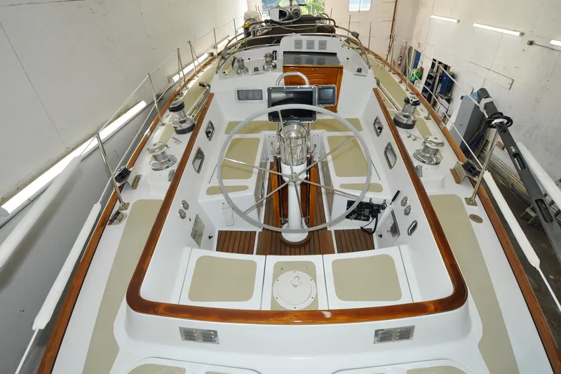 Slide: The Image of 1986 Hinckley Sou'wester 51 sailboat cockpit with steering wheel and control panels. - 31