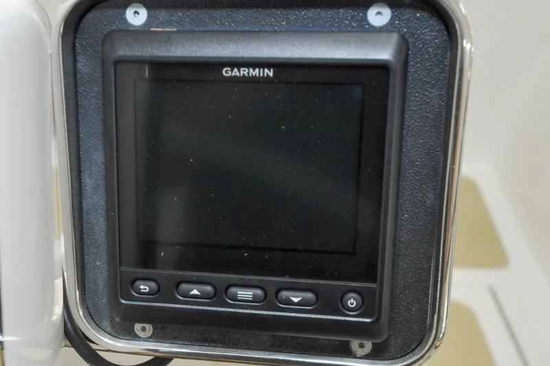 Slide: The Image of Garmin navigation display on 1986 Hinckley Sou'wester 51 yacht, featuring control buttons. - 35