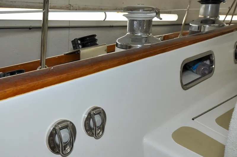 Slide: The Image of Hinckley Sou'wester 51 sailboat deck details, 1986 model, featuring winches and storage compartments. - 39