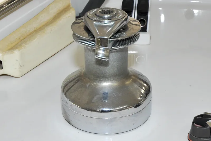 Slide: The Image of Chrome winch on 1986 Hinckley Sou'wester 51 sailboat deck. - 44