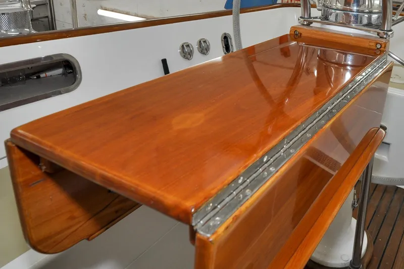Slide: The Image of Polished wooden surface on 1986 Hinckley Sou'wester 51 yacht, showcasing craftsmanship and elegance. - 46