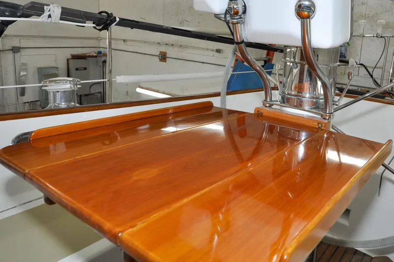 Slide: The Image of Polished wooden helm station on 1986 Hinckley Sou'wester 51 sailboat. - 47