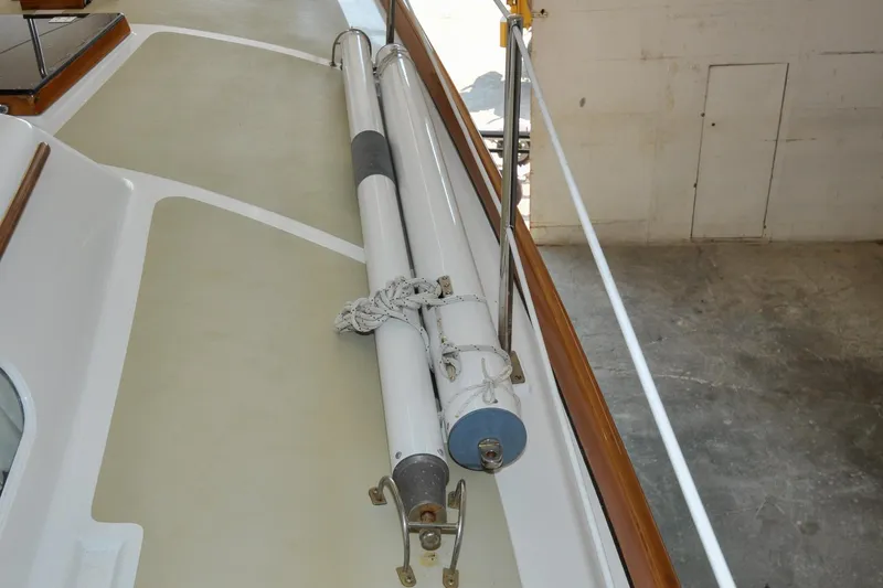 Slide: The Image of 1986 Hinckley Sou'wester 51 deck with stored sail poles. - 53