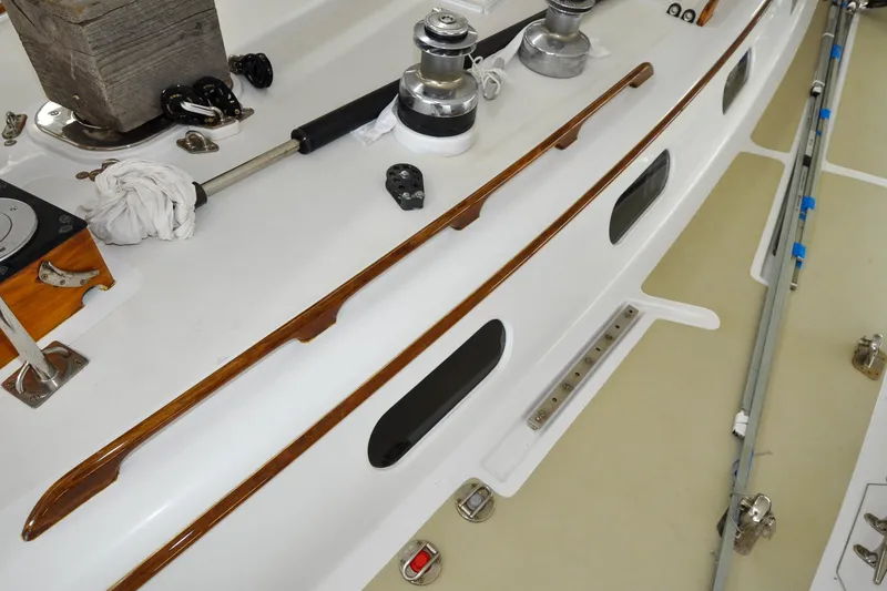 Slide: The Image of Deck of 1986 Hinckley Sou'wester 51 sailboat with winches and wooden trim. - 60