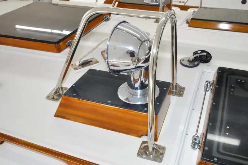 Slide: The Image of Polished chrome spotlight on 1986 Hinckley Sou'wester 51 yacht deck. - 64