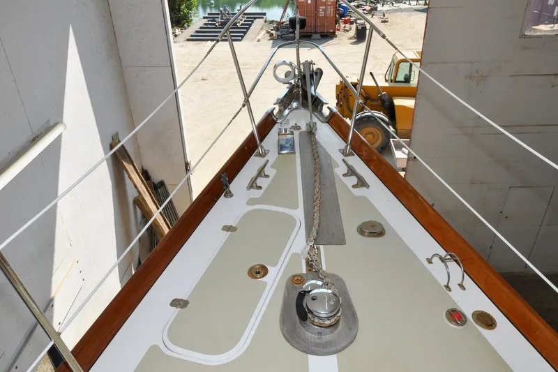 Slide: The Image of Hinckley Sou'wester 51 sailboat deck, 1986 model, featuring anchor chain and winch. - 69