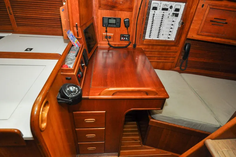Slide: The Image of Hinckley Sou'wester 51 (1986) yacht interior with navigation station and control panel. - 78
