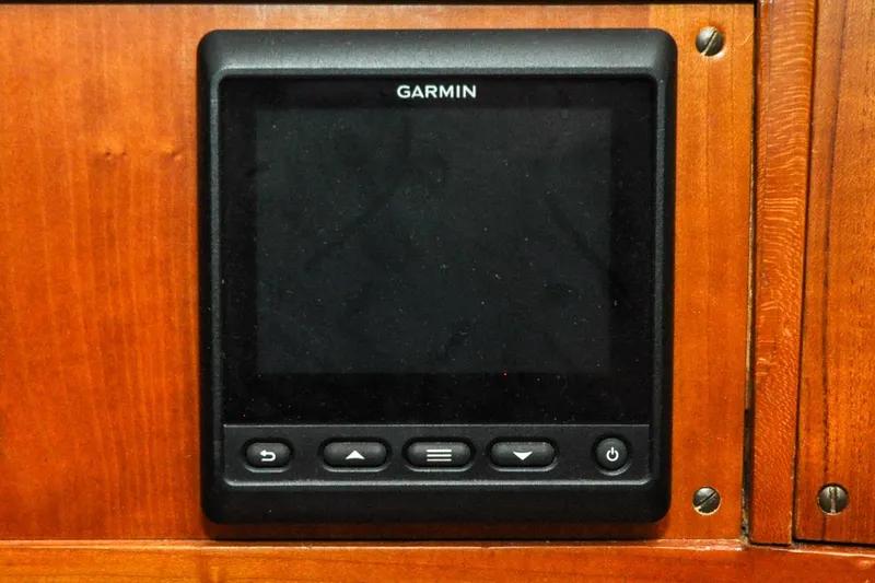 Slide: The Image of Garmin device on 1986 Hinckley Sou'wester 51 yacht's wooden panel. - 83