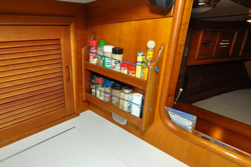 Slide: The Image of Wooden spice rack in 1986 Hinckley Sou'wester 51 yacht interior kitchen. - 94