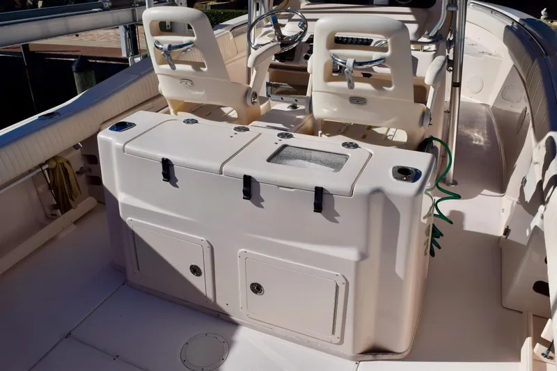 Slide: The Image of 2006 Grady-White Bimini 306 boat interior with seating and storage compartments. - 10