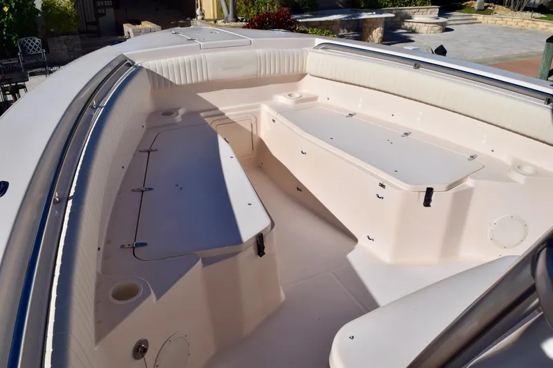 Slide: The Image of 2006 Grady-White Bimini 306 boat interior with seating and storage compartments. - 12