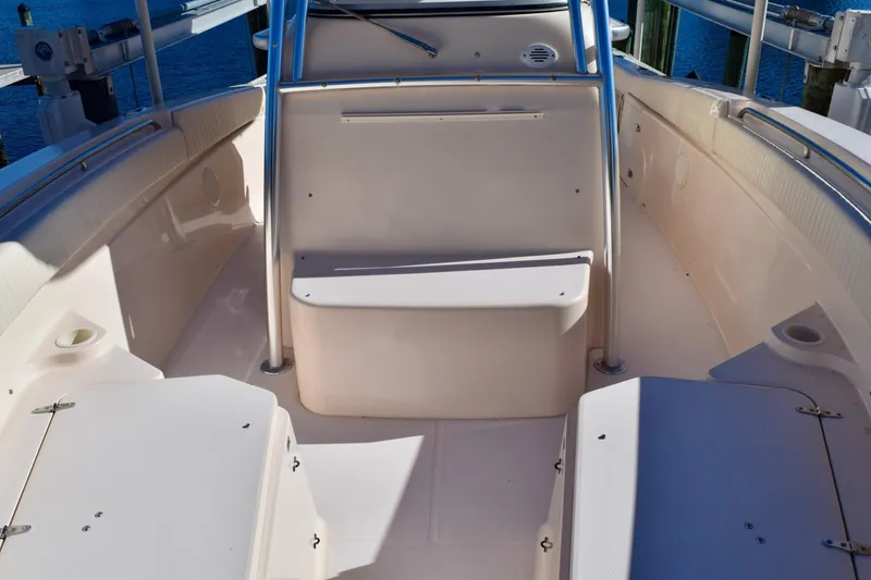 Slide: The Image of 2006 Grady-White Bimini 306 boat interior with seating and storage compartments. - 13