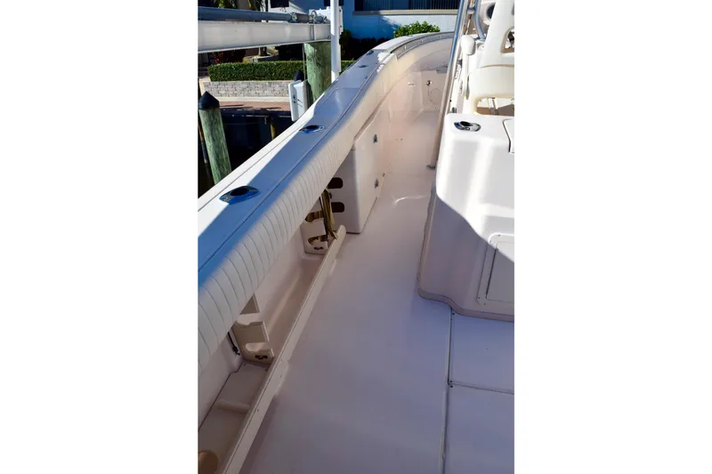 Slide: The Image of 2006 Grady-White Bimini 306 boat interior, showcasing clean deck and seating area. - 18