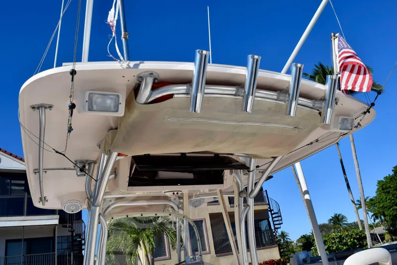 Slide: The Image of 2006 Grady-White Bimini 306 boat with rod holders and American flag. - 6
