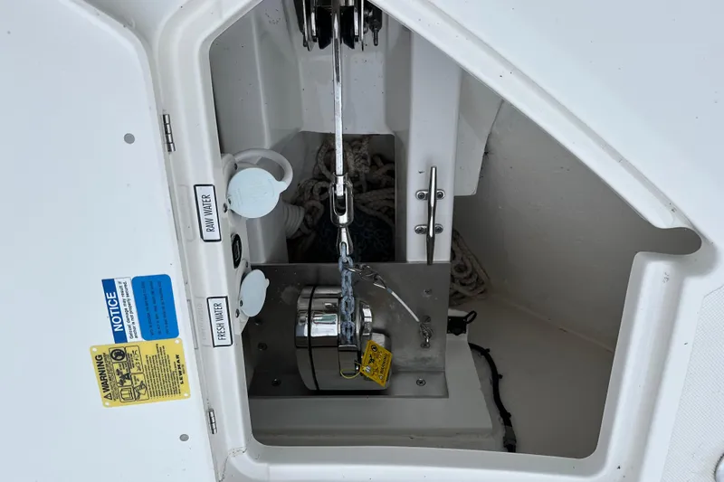 Slide: The Image of 2023 Pursuit DC 326 Dual Console boat on calm blue ocean waters. - 14