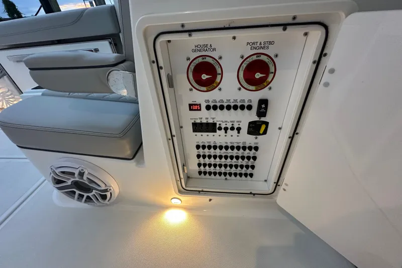 Slide: The Image of 2023 Pursuit DC 326 Dual Console electrical panel with controls and speaker. - 40