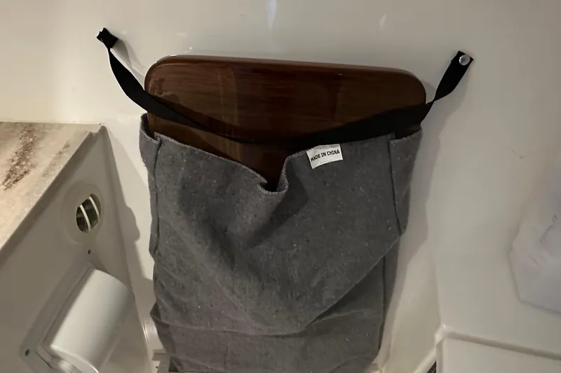 Slide: The Image of Storage pocket with wooden board on 2023 Pursuit DC 326 Dual Console boat. - 44