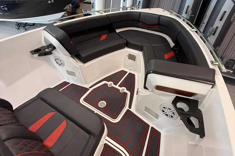 Slide: The Image of Luxurious interior of 2026 Monterey Elite 27 SD boat with black and red seating. - 15