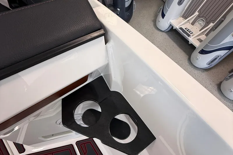 Slide: The Image of Interior of 2026 Monterey Elite 27 SD boat with cup holders and seating. - 16