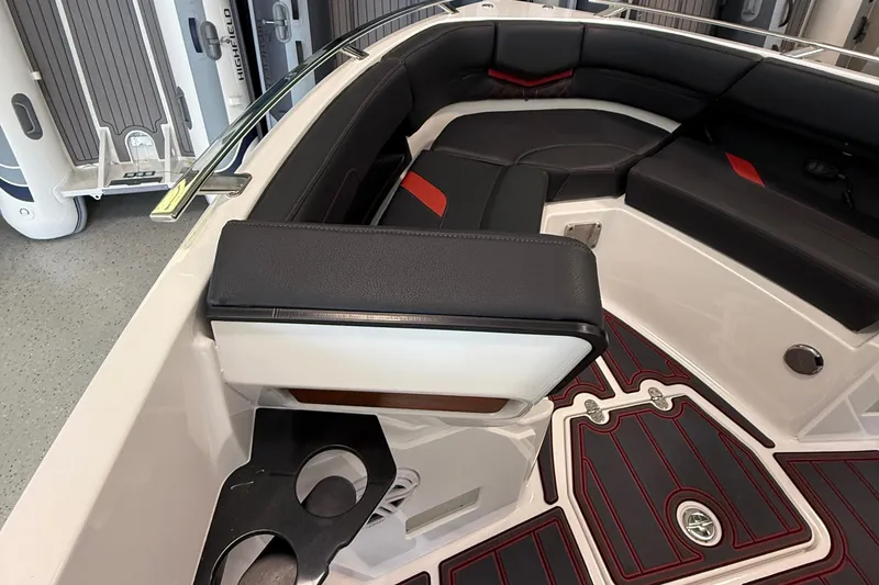 Slide: The Image of 2026 Monterey Elite 27 SD boat interior with black and red seating, cup holders, and sleek design. - 18