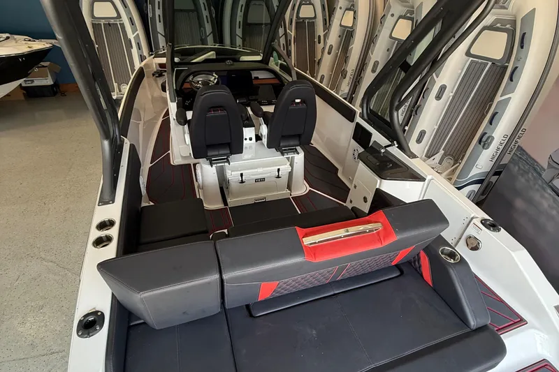 Slide: The Image of 2026 Monterey Elite 27 SD boat interior with sleek seating and modern dashboard design. - 7