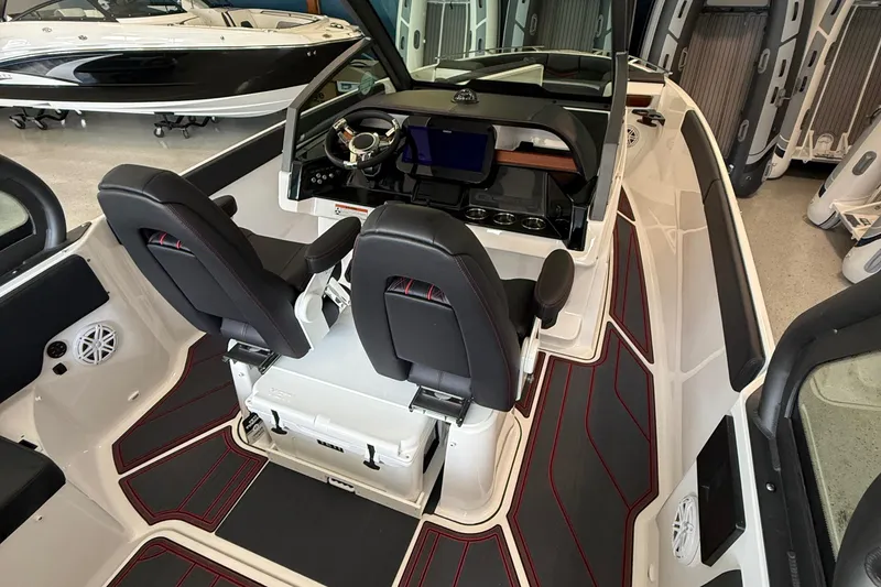Slide: The Image of 2026 Monterey Elite 27 SD boat interior with modern dashboard and seating. - 8