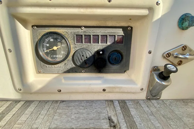 Slide: The Image of Control panel of a 1993 Pacific Seacraft 34 sailboat with Yanmar RPM gauge. - 6