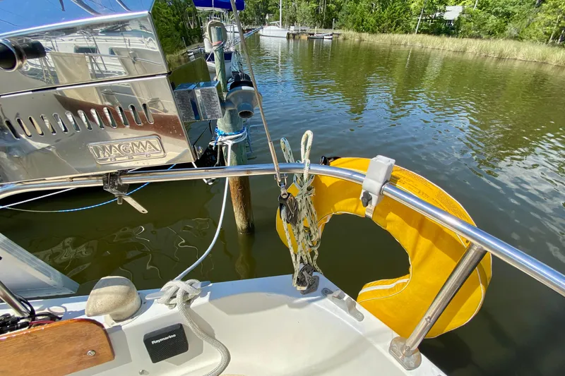 Slide: The Image of 1977 Allied Princess Cutter with yellow life ring and Magma grill on deck. - 10